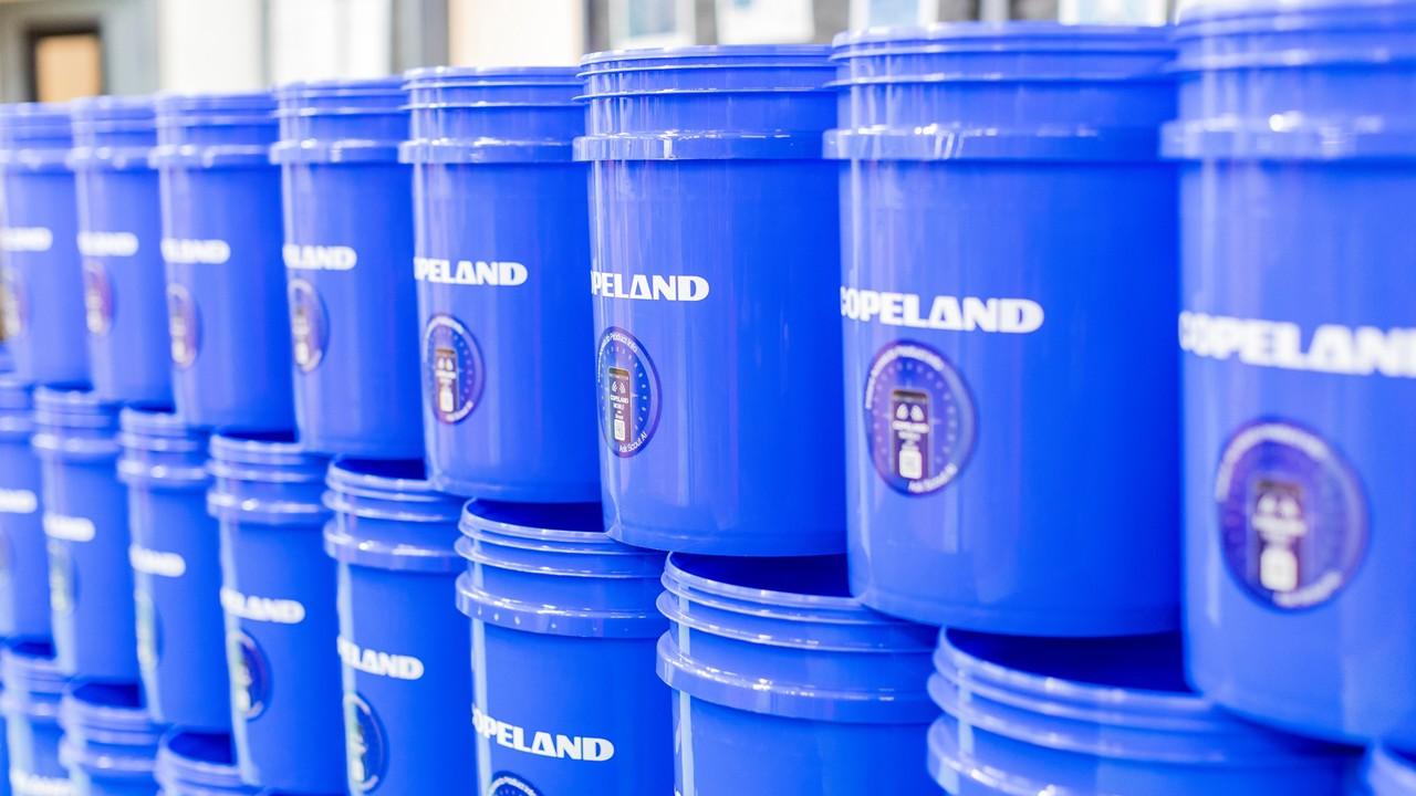 Branded giveaway buckets arranged for event attendees