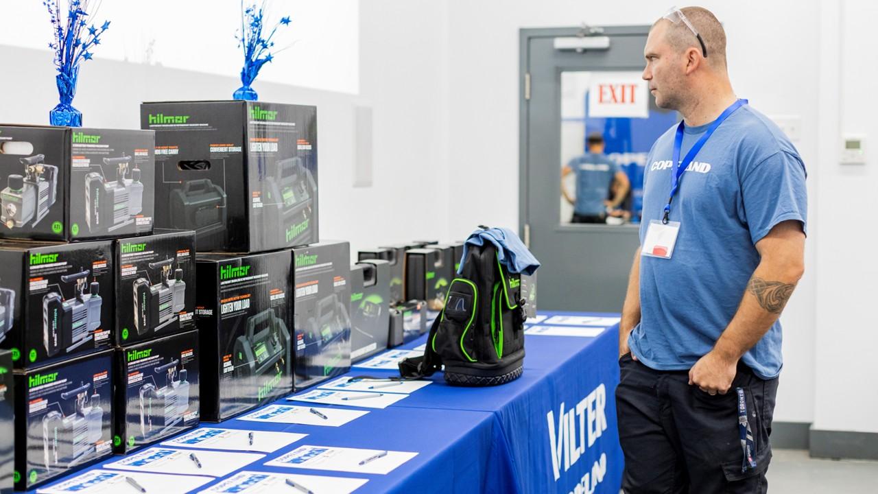 Attendee viewing tools, product displays and other auction giveaway items on a table