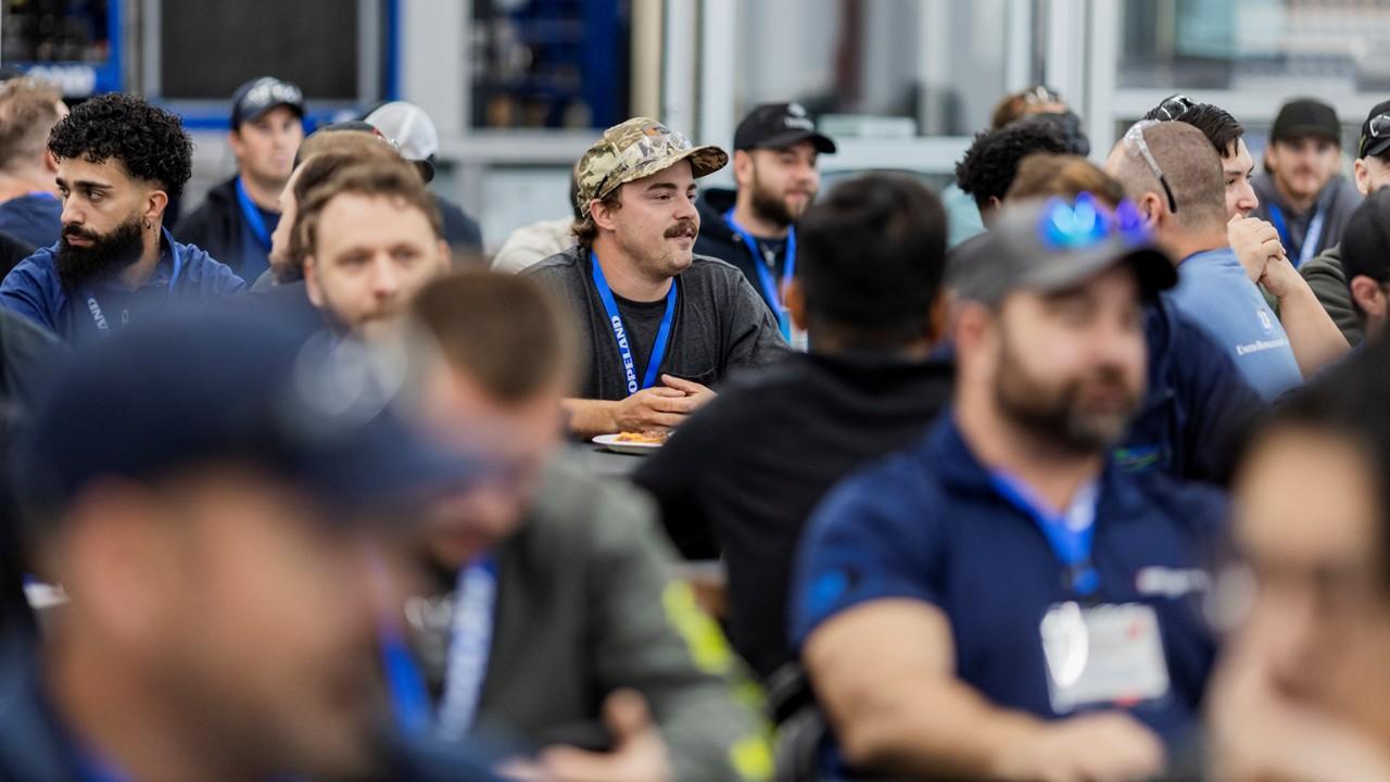 HVACR apprentices seated and enjoying a meal together during a training presentation