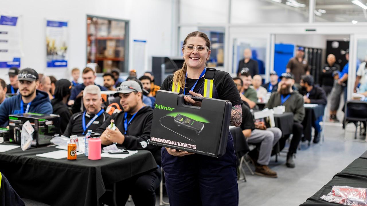Attendee holding a prize during an event giveaway